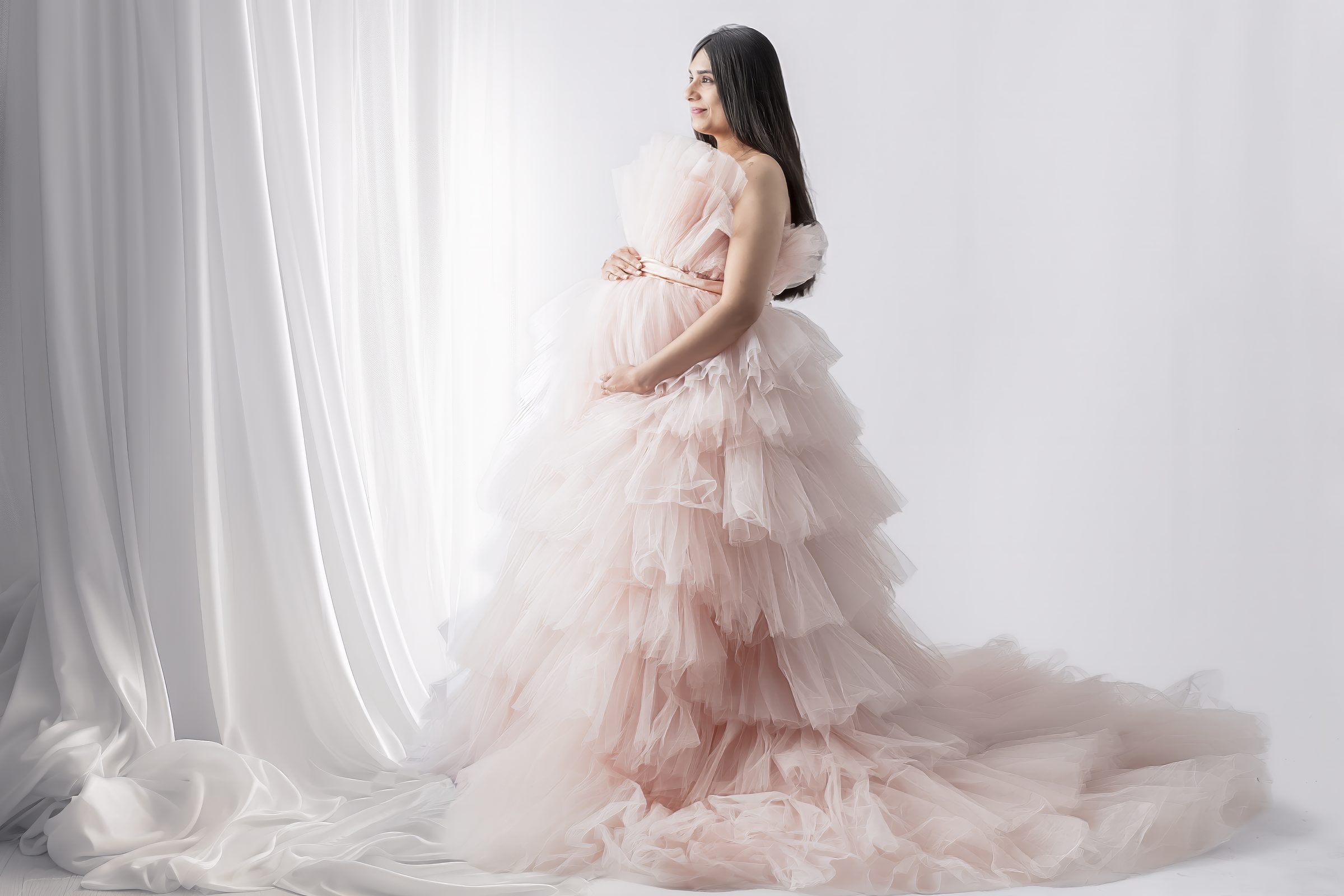 Studio maternity portrait in pink tulle gown — IDTPhoto Aurora IL