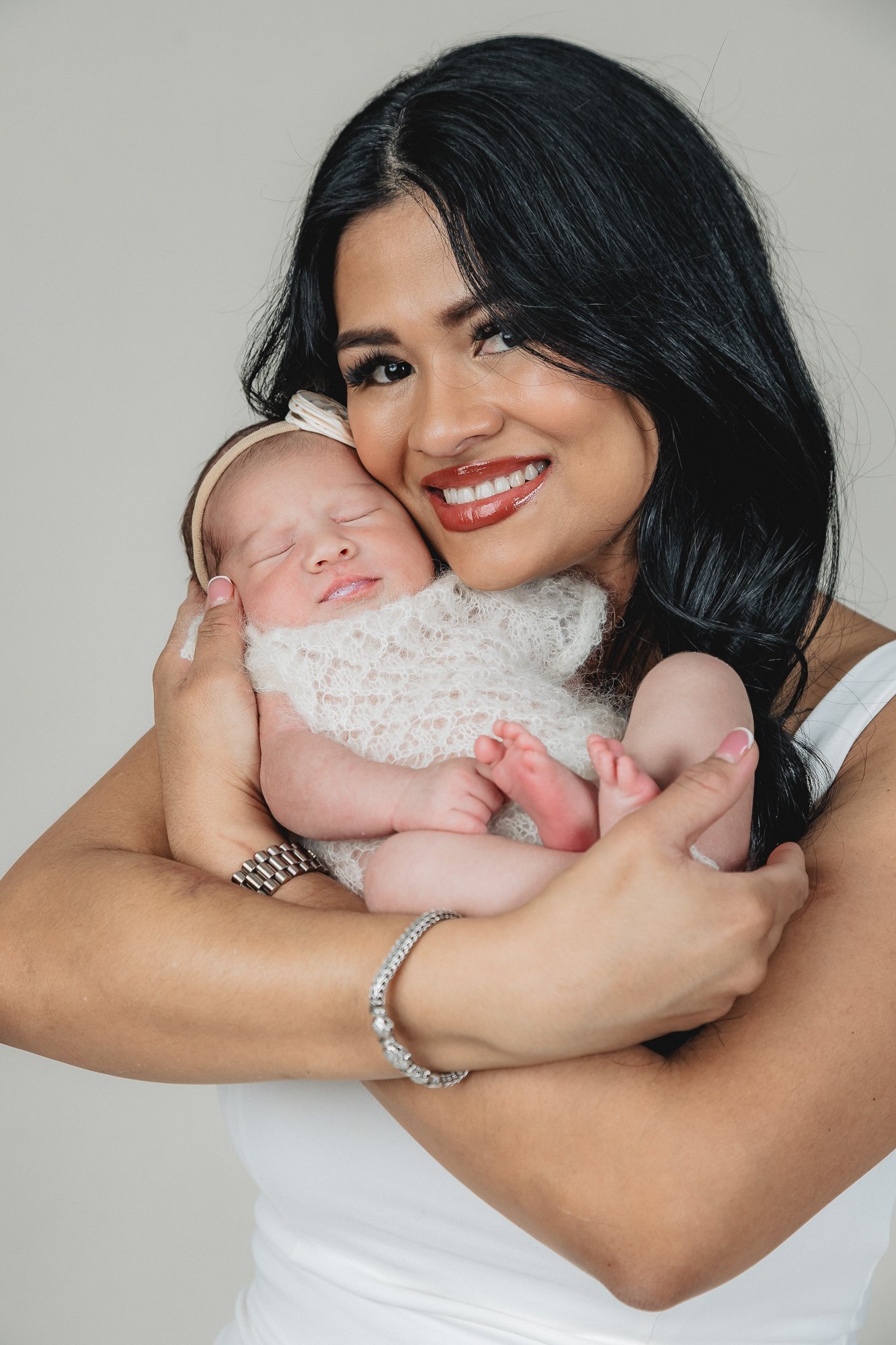 Mother cheek to cheek with sleeping newborn girl in white lace wrap — IDTPhoto Aurora IL newborn photographer